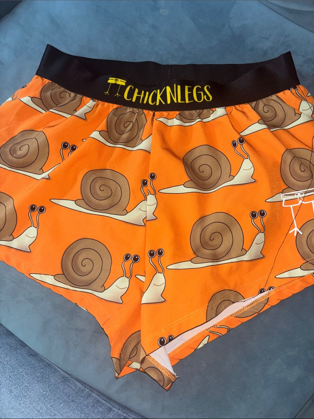 Chicknlegs Orange Snail-Print Athletic Shorts for Men